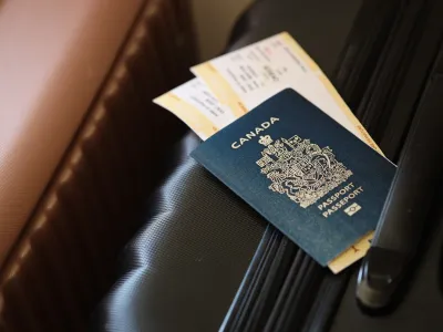 Canadian passport with airline tickets