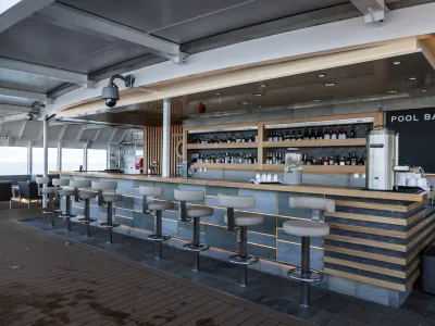 HX_Hurtigruten_Expeditions__MS_Roald_Amundsen__Pool_Bar___Oscar_Farerra